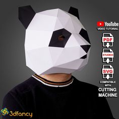 a man wearing a panda mask made out of paper