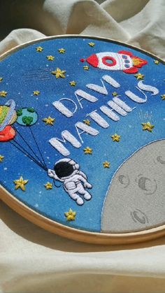 an embroidered sign with the words dad's day on it and space shuttles