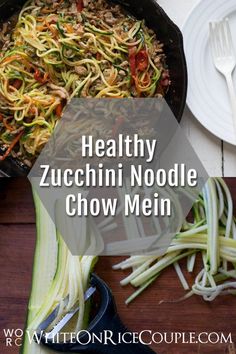 healthy zucchini noodle chow mein in a cast iron skillet on a wooden table