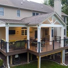 a house with a deck and covered patio