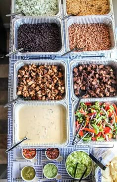 several trays filled with different types of food