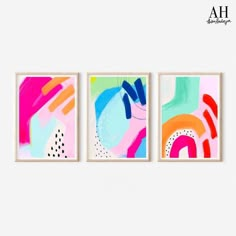 three abstract paintings hanging on the wall