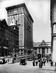 an old black and white photo of people in the city