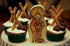 cupcakes decorated with chocolate and white frosting