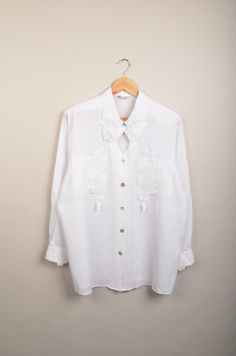 "vintage white bohemian blouse in great vintage condition. This white blouse is a very nice vintage item with great details. Size: 42 (check the measurements) Measurements: - Chest(armpit to armpit)59cm(23.2\") - Length from the backside(Center bottom of the collar to center bottom of the garment): 78cm(30.7\") - Sleeve(COLLAR seam to end of arm cuff): 44cm(17.3\") NOTE: Due to the age, clothing/items can shrink or it may be that the sizing from that time the item was made in, is not the same as Casual White Blouse With Boho Collar, White Relaxed Fit Blouse With Collared Neckline, Oversized Summer Blouse With Collar, Oversized Collar Blouse For Summer, White Blouse With Relaxed Fit And Collared Neckline, White Blouse With Collared Neckline And Relaxed Fit, White Collared Blouse For Fall, White Collared Shirt For Daywear, Chic White Shirt With Collared Neckline