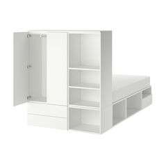 a white bed sitting next to an open cabinet on top of a floor in front of a white wall