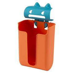 an orange and blue toothbrush holder on a white background