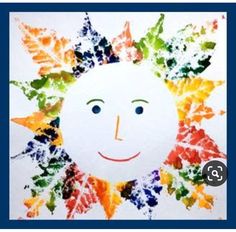 a child's drawing of a sun with leaves painted on the front and sides