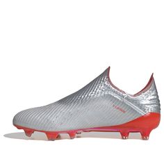 a silver and red soccer shoe on a white background