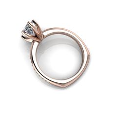 a rose gold ring with a diamond in the center