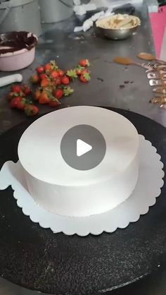 there is a cake that has been cut and placed on the table with other food items around it