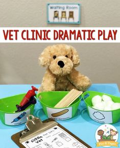 a teddy bear sitting in front of some bowls and spoons on a blue table