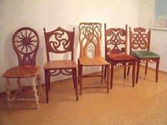 five chairs are lined up against the wall