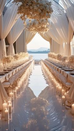 an outdoor wedding setup with white drapes, candles and floral centerpieces on the tables