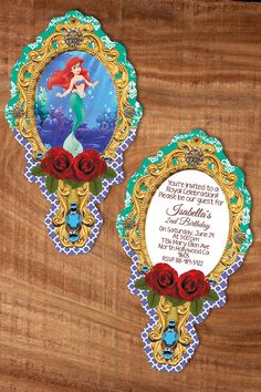 the little mermaid themed birthday party is set up on a wooden table with flowers and an ornate frame