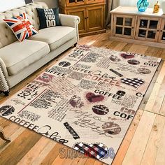 a living room filled with furniture and a rug on top of a hard wood floor