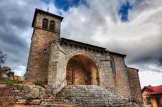 an old stone building with steps leading up to it