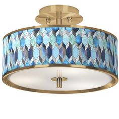 a semi flush light fixture with blue and white mosaic glass shades on the drum shade