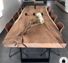 a large wooden table with chairs around it