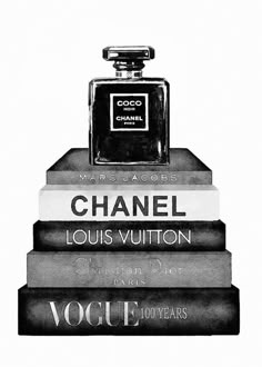 black and white photograph of chanel perfume bottle on stack of books with words written in french