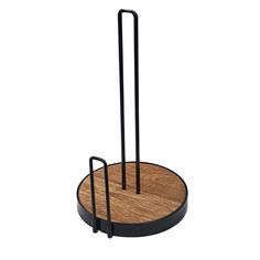 a wooden and metal holder with two black handles