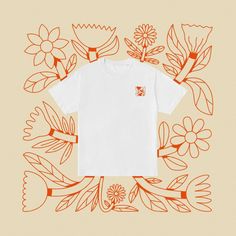 a white t - shirt with an orange flower design on the front and back side