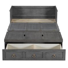 an open gray bed with drawers underneath it