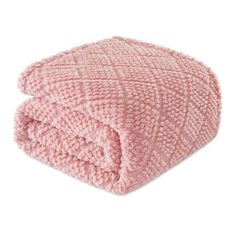 a pink blanket on top of a white surface