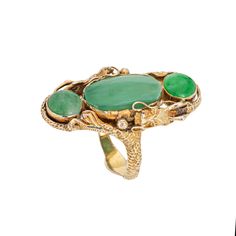 Unique & sylish vintage dragon ring (circa 1970s) crafted in 14 karat yellow gold.  Jade measures 15mm x 8mm (center) and 6.5mm. The jade is in very good condition and free of cracks or chips.  The elaborate ring highlights two dragons, coiled around the mount with the tails meeting at the base of the ring. The dragon is a symbol of power, strength and good luck. The ring has a low profile and sits flat on the finger (larger in scale the long (1 1/4 inch) mount makes a great statement on the hand. Great worn alone as a statement piece or stacked.  The ring is in very good condition. We have not cleaned the ring in order to preserve the patina and collector value. Particulars: Weight: 8.5 grams Stones:  Jade measures 15mm x 8mm (center) and 6.5mm. The jade is in very good condition and free Two Dragons, Masonic Jewelry, Russian Jewelry, Antique Jewelry Rings, Jade Dragon, Vintage Dragon, Dragon Ring, Art Nouveau Jewelry, Ring Ideas