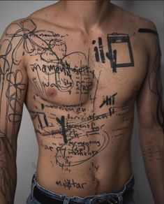 a man with lots of writing on his chest