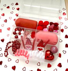 a plastic container filled with valentine's day treats