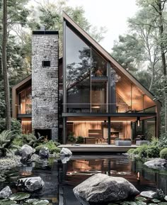 a house that is surrounded by water and rocks in the middle of a forest with lily pads on the ground