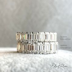 three different sized diamond rings sitting on top of each other