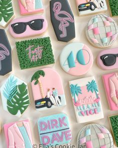 decorated cookies are arranged in the shape of palm trees, sunglasses, and beach scenes