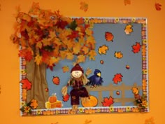 a paper fall scene with a scarecrow sitting on a bench next to a tree