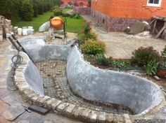 an outdoor pool being built in the middle of a yard