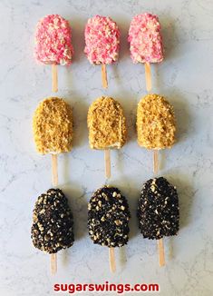 six different types of lollipops with sprinkles and toppings