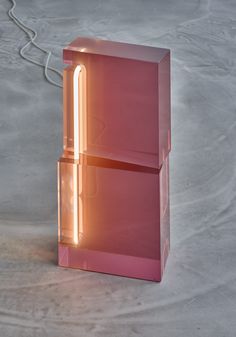 a pink object with a light coming out of it