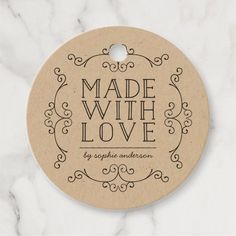 a round wooden ornament with the words hand made with love on it