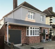 a two story house with an attached garage