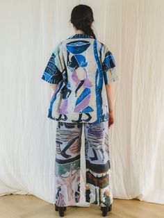 Step into the world of sustainable fashion with our Sugar Cream upcycled trousers. Crafted from unique tribal wax print in bold, vibrant colors, these wide leg trousers are an exquisite addition to your wardrobe. The elasticated waist with belt loops and button, along with front pockets, offer both comfort and style. Embrace ethical fashion with these immaculate, special trousers. Care: Cool machine wash. Dry at a lower heat and press with a medium iron.  Condition: Please note due to this piece Upcycled Trousers, Artisan Gift, Art Historian, Wax Print, Vintage Love, Independent Designers Fashion, Ethical Fashion, Fast Fashion, Wide Leg Trousers