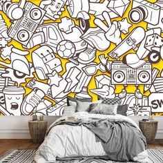 a bedroom with yellow and white wallpaper that has various items on it, including a bed