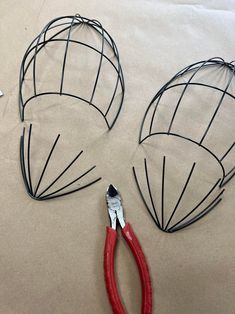 the wire is being cut out to be used as headpieces for mickey mouse ears