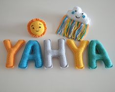 the word yaha spelled out in crochet letters with a smiling face, lion and cloud