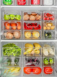 an open refrigerator filled with lots of different types of vegetables and fruits in it's containers