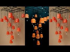 an assortment of orange lamps hanging from the ceiling