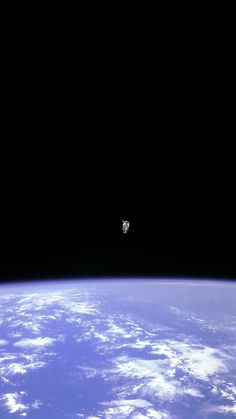 the space shuttle is flying over the earth's horizon in this view from outer space