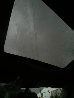 the rain is falling on the windshield of a car