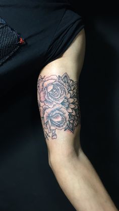 a person with a flower tattoo on their arm