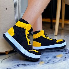 Handcrafted Yellow & Black Crochet Sneaker Slippers - Unisex Jordan-Inspired Cozy Plush Home Shoes - Stylish Non-Slip Knit Basketball Slippers - Unique Artisanal Sneaker-Style Booties - Comfy Collectible Loungewear Footwear - Perfect Gift for Sneakerheads Experience the ultimate blend of sports legacy and homestyle comfort with our Handmade Sneaker Slippers, a premium addition to any loungewear collection. Drawing inspiration from the basketball courts, our Jordan-Inspired Home Shoes capture the spirit of the game in a vibrant yellow and black color scheme. Each pair of our Yellow Black Crochet Slippers is a masterpiece of craftsmanship, meticulously woven to offer a unique sneaker style slipper that stands out from the crowd. Designed for fans, fashionistas, and comfort-seekers alike, the Comfy Crochet, Yellow Slippers, Collection Drawing, Jordan Style, Knit Slippers, Basketball Courts, Shoes Stylish, Black Jordans, Unique Sneakers